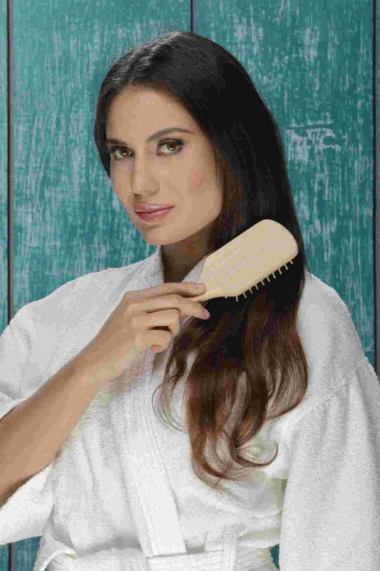Natural wooden detangling hair brush for smooth hair care
